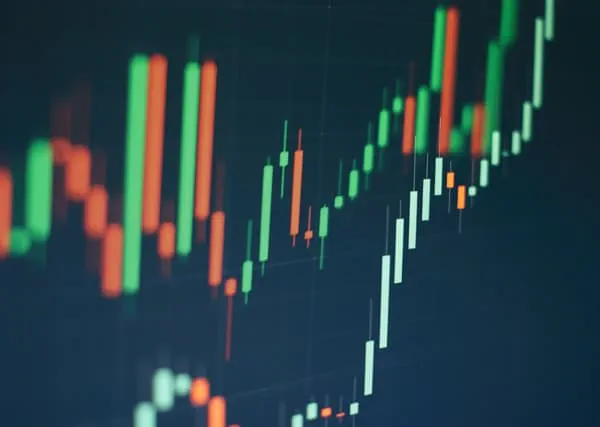 A trading view graph with green and red lines